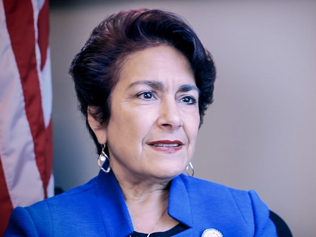 California State Senator Anna Caballero stands with farmworkers.